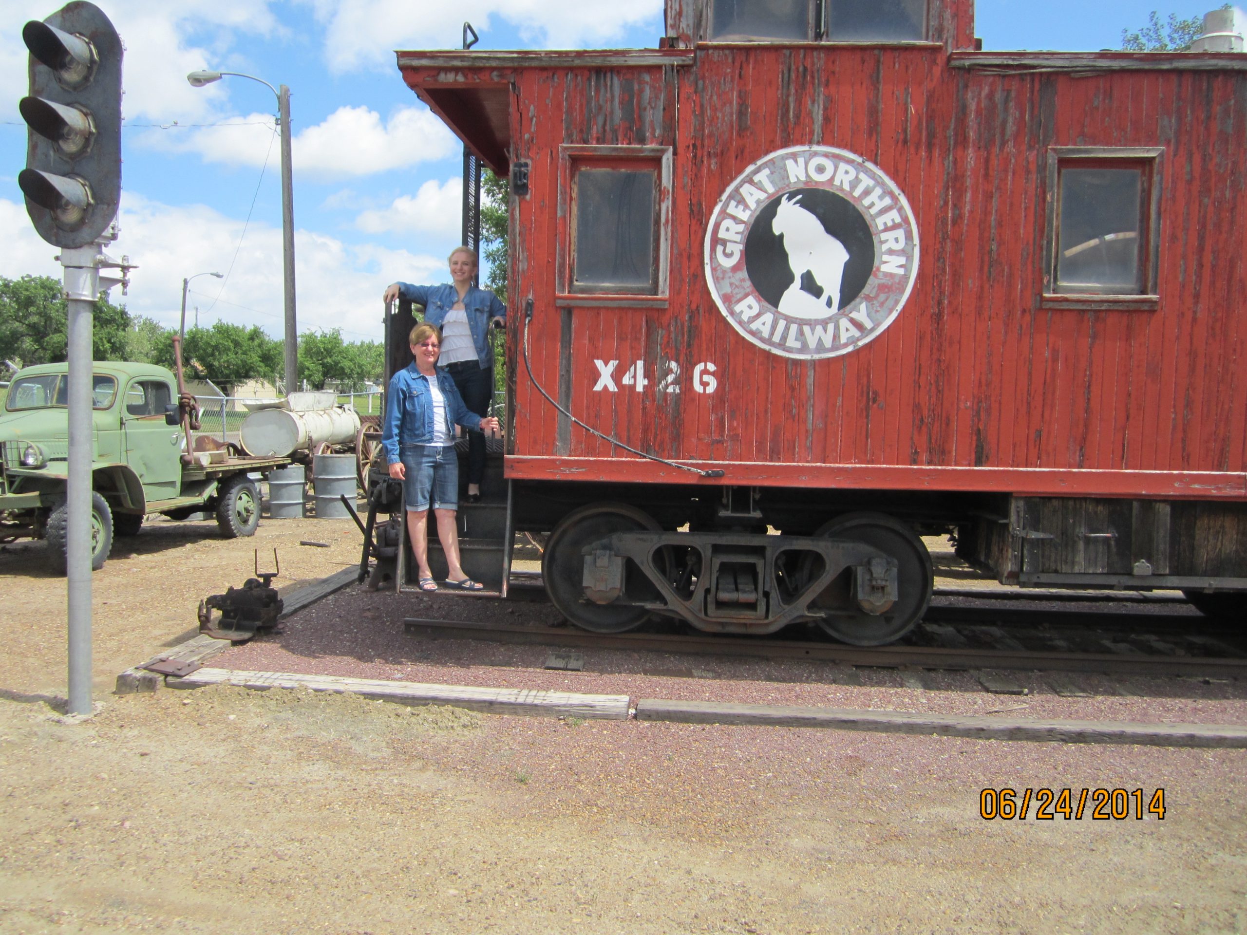 Kayla & Grandma Sylvia by donated caboose at museum